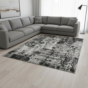 HomeRoots 9' X 12' Abstract Area Rug in Black, Ivory & Gray - Washable, UV-Protected, Durable & Stylish Design 679095