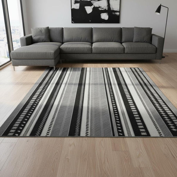 HomeRoots 9' X 12' Washable Tribal Area Rug in Black, Gray & Silver - UV Protected, Easy Care, Durable Design 679257