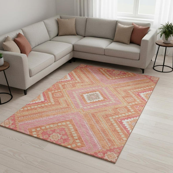 HomeRoots 10' X 14' Coral Pink Tribal Area Rug – Durable, Washable, UV Protected for Modern Living Spaces! 679276