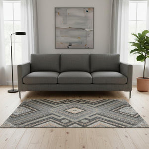 HomeRoots 5' X 8' Gray Peach Silver Tribal Area Rug - Washable, UV Protected, Stain Resistant, Soft Comfort 679284