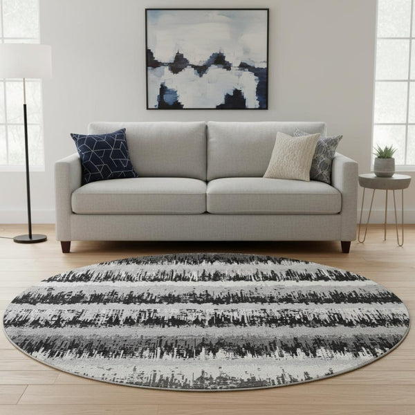 HomeRoots 8' Striped Washable Round Rug in Black, Ivory, and Gray - UV Protected, Pet & Kid Friendly Design 679477