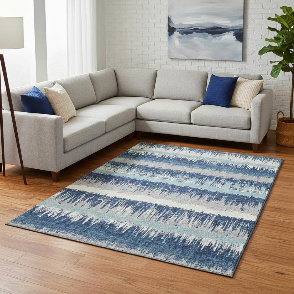 HomeRoots 8' X 10' Striped Washable Area Rug in Blue, Ivory & Gray - Durable, UV Protected for High-Traffic Areas 679490