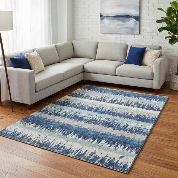 HomeRoots 9' X 12' Coastal-Inspired Blue Ivory Gray Striped Washable Area Rug with UV Protection & Durability 679491