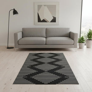 HomeRoots 5' X 8' Black And Ivory Geometric Area Rug - Washable, UV Protected, Stain Resistant for Families 679692