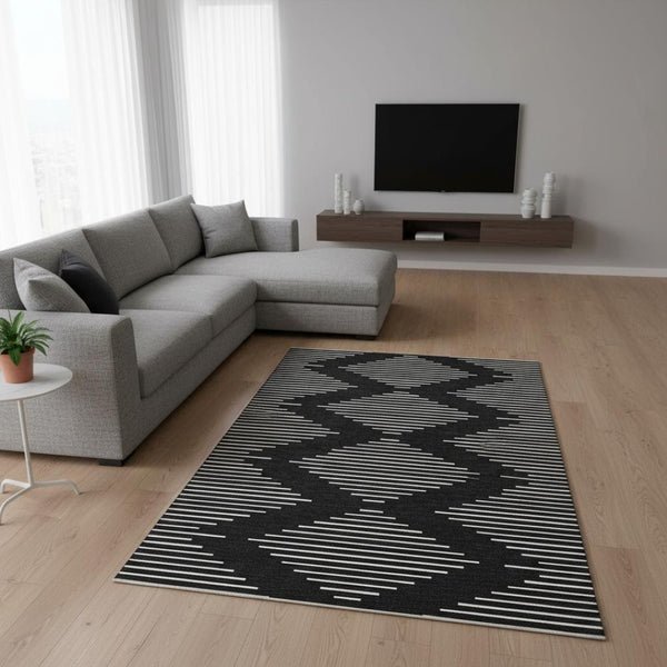 HomeRoots 8' X 10' Stylish Black and Ivory Geometric Washable Area Rug with UV Protection for High-Traffic Spaces 679694