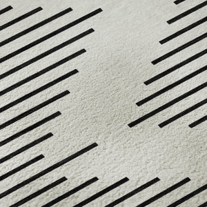 HomeRoots 5' X 8' Ivory And Black Geometric Area Rug - Stylish, Washable, UV Protected for Modern Spaces 679740