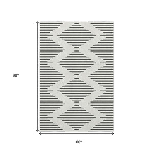 HomeRoots 5' X 8' Ivory And Black Geometric Area Rug - Stylish, Washable, UV Protected for Modern Spaces 679740