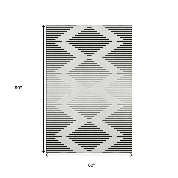 HomeRoots 5' X 8' Ivory And Black Geometric Area Rug - Stylish, Washable, UV Protected for Modern Spaces 679740