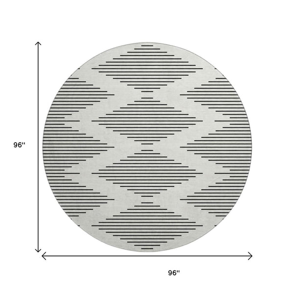 HomeRoots 8' Ivory and Black Geometric Round Rug - Washable, UV-Protected, Stain-Resistant, Durable Design 679741