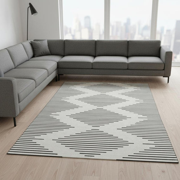 HomeRoots 9' X 12' Ivory and Black Geometric Area Rug - Stain-Resistant, UV Protected, Perfect for Busy Homes 679743