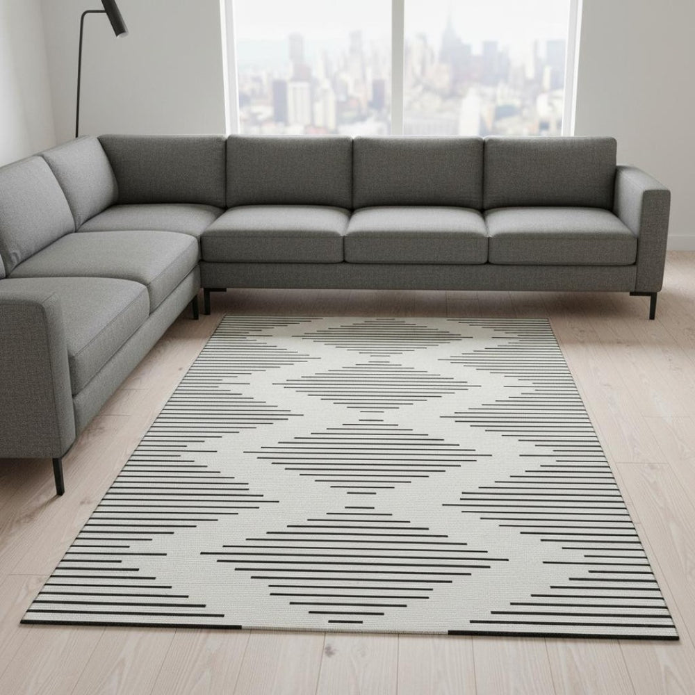 HomeRoots 10' X 14' Modern Ivory & Black Geometric Washable Area Rug with UV Protection for High-Traffic Spaces 679744