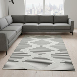 HomeRoots 10' X 14' Modern Ivory & Black Geometric Washable Area Rug with UV Protection for High-Traffic Spaces 679744