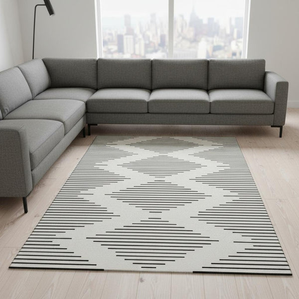 HomeRoots 10' X 14' Modern Ivory & Black Geometric Washable Area Rug with UV Protection for High-Traffic Spaces 679744