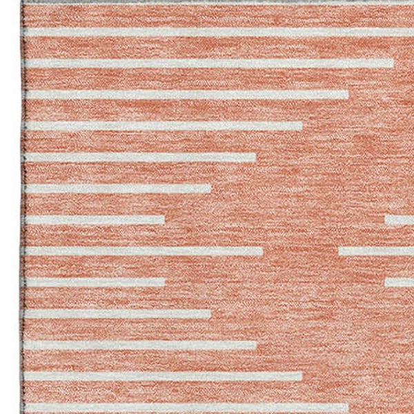 HomeRoots 5' X 8' Salmon and Ivory Geometric Area Rug - Washable, UV Protected, Stylish, and Durable Design 679776