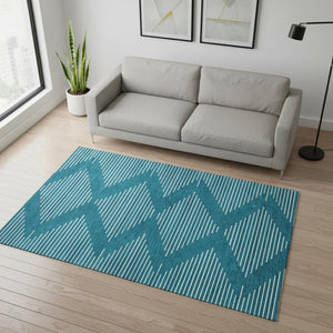 HomeRoots 5' X 8' Teal and Ivory Geometric Area Rug - Washable, Stain Resistant, UV Protected for Everyday Use 679782