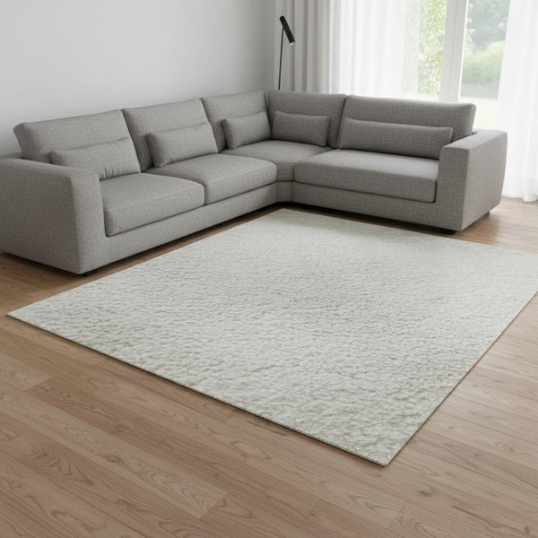 HomeRoots 8' X 10' Ivory and Beige Abstract Area Rug – Washable, UV Protected, Modern Design for Easy Living 679951