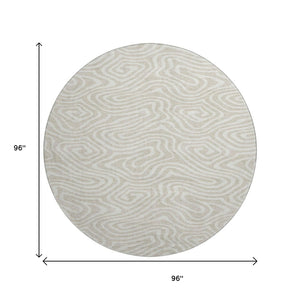 HomeRoots 8' Beige and Ivory Abstract Round Washable Rug - Stain Resistant, UV Protected for High Traffic Areas 680064
