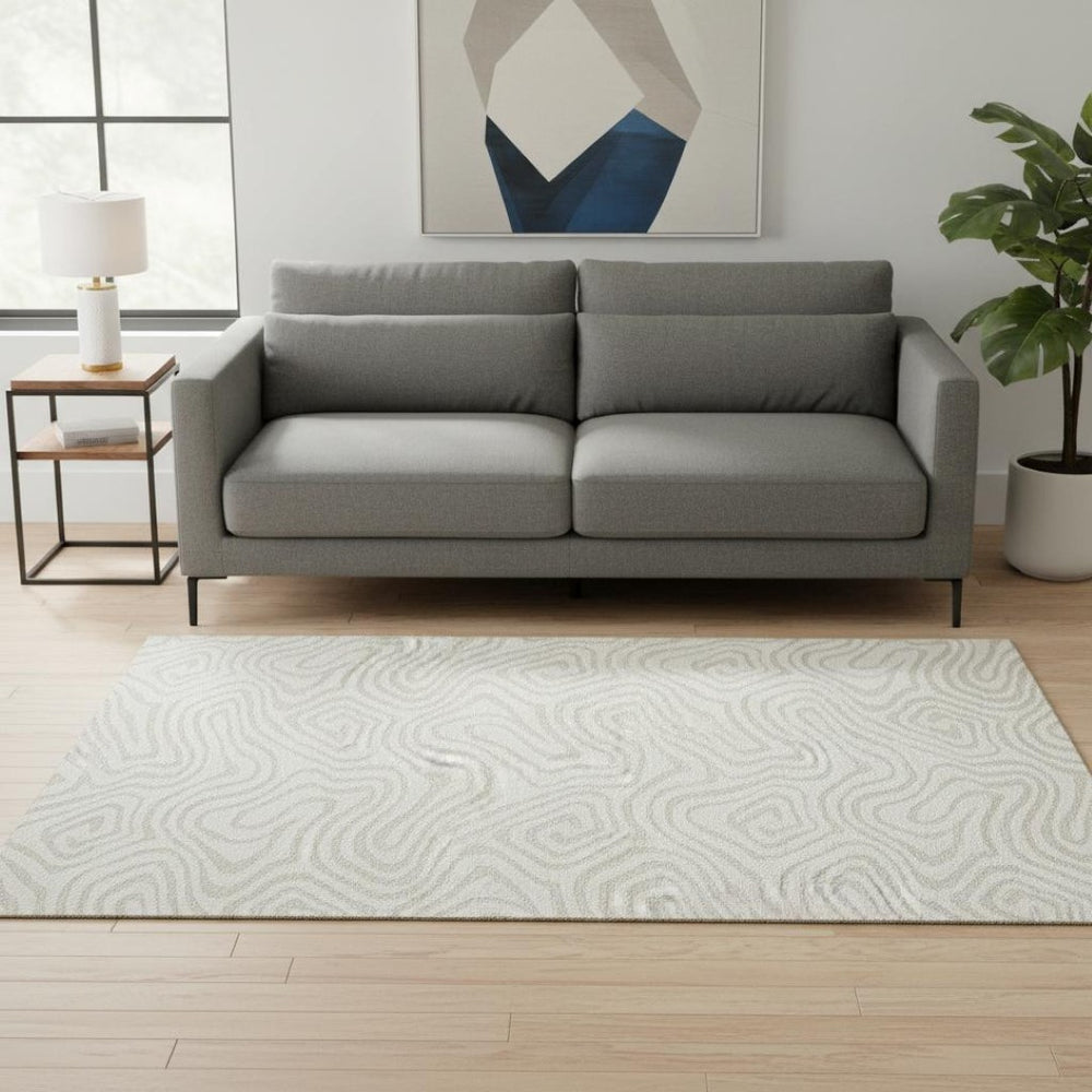HomeRoots 5' X 8' Ivory and Beige Abstract Area Rug - Washable, Stain Resistant, UV Protected for Families 680093