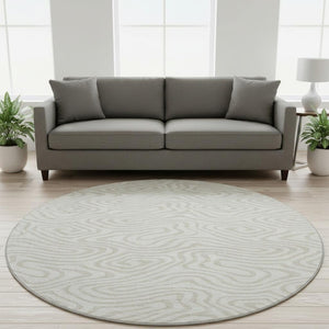 HomeRoots 8' Ivory and Beige Abstract Round Rug - Washable, UV Protected, Soft, Durable for High-Traffic Areas 680094
