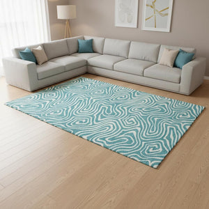 HomeRoots 10' X 14' Teal and Ivory Abstract Area Rug - Washable, UV-Protected, Stylish for Modern Living Spaces 680139