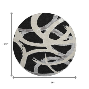 HomeRoots 8' Modern Abstract Black, Ivory & Gray Washable Round Rug with UV Protection for High-Traffic Areas 680232