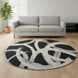 HomeRoots 8' Modern Abstract Black, Ivory & Gray Washable Round Rug with UV Protection for High-Traffic Areas 680232
