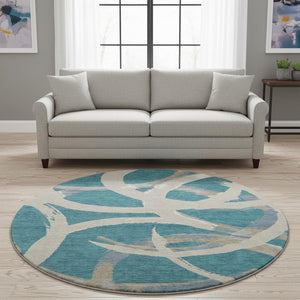 HomeRoots 8' Teal Ivory and Gray Abstract Washable Round Rug - Durable, Stain-Resistant, UV Protected Design! 680292