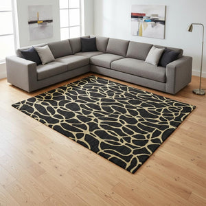 HomeRoots 9' Black and Gold Geometric Area Rug - Washable, UV-Protected, Stylish, Durable for High-Traffic Spaces 680306
