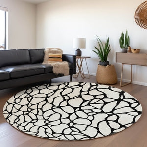 HomeRoots 8' Ivory and Black Geometric Round Rug - Washable, UV Protected, Durable Design for Busy Homes 680328
