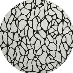 HomeRoots 8' Ivory and Black Geometric Round Rug - Washable, UV Protected, Durable Design for Busy Homes 680328