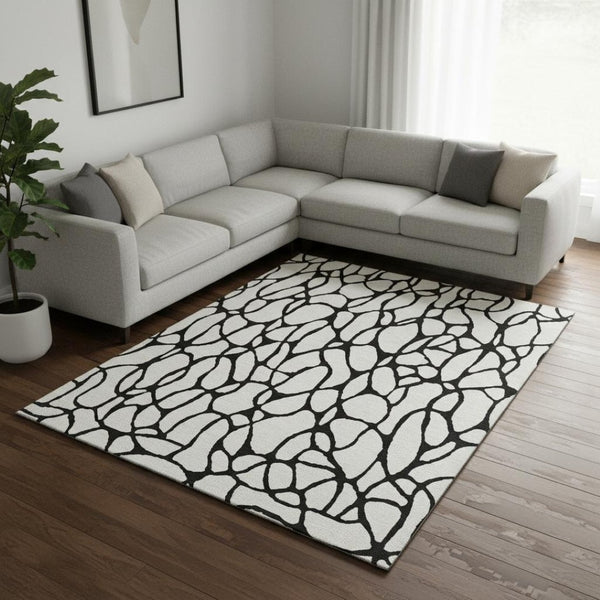 HomeRoots 9' X 12' Ivory And Black Geometric Area Rug - Durable, Washable, UV-Protected for High-Traffic Homes 680330