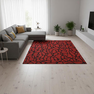 HomeRoots 5' X 8' Red and Black Geometric Area Rug - Washable, UV Protected, Stain Resistant for Modern Living 680363