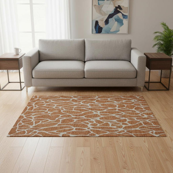 HomeRoots 5' X 8' Geometric Area Rug in Rust & Ivory - Washable, UV Protected, Durable for High-Traffic Spaces 680429