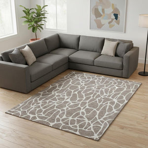 HomeRoots 9' X 12' Taupe And Ivory Geometric Area Rug - Washable, UV Protected, Perfect for Family Spaces! 680444