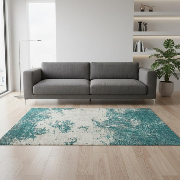 HomeRoots 5' X 8' Teal and Ivory Abstract Area Rug - Washable, UV-Protected, Stylish for High-Traffic Spaces 680671