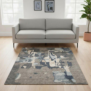HomeRoots 5' X 8' Stylish Taupe Beige Cream Abstract Area Rug – Washable, UV Protected, Stain Resistant Design 680749