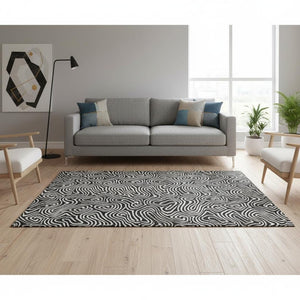 HomeRoots 5' X 8' Black And Ivory Abstract Area Rug - Stylish, Washable, UV-Protected for Modern Homes 680839