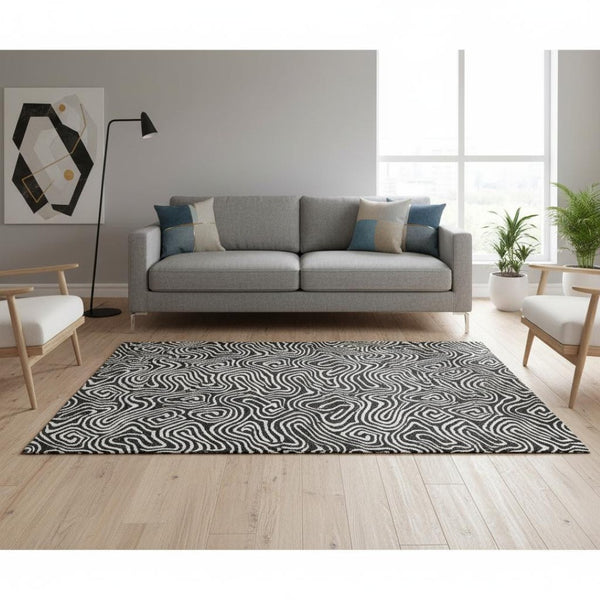 HomeRoots 5' X 8' Black And Ivory Abstract Area Rug - Stylish, Washable, UV-Protected for Modern Homes 680839