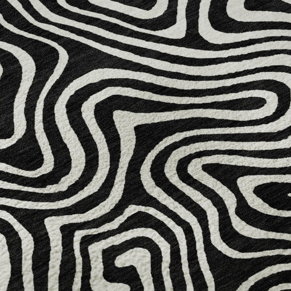 HomeRoots 8' Black And Ivory Abstract Round Rug - Washable, UV-Protected, Stain Resistant for Stylish Durability 680840