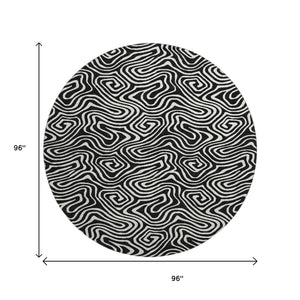 HomeRoots 8' Black And Ivory Abstract Round Rug - Washable, UV-Protected, Stain Resistant for Stylish Durability 680840