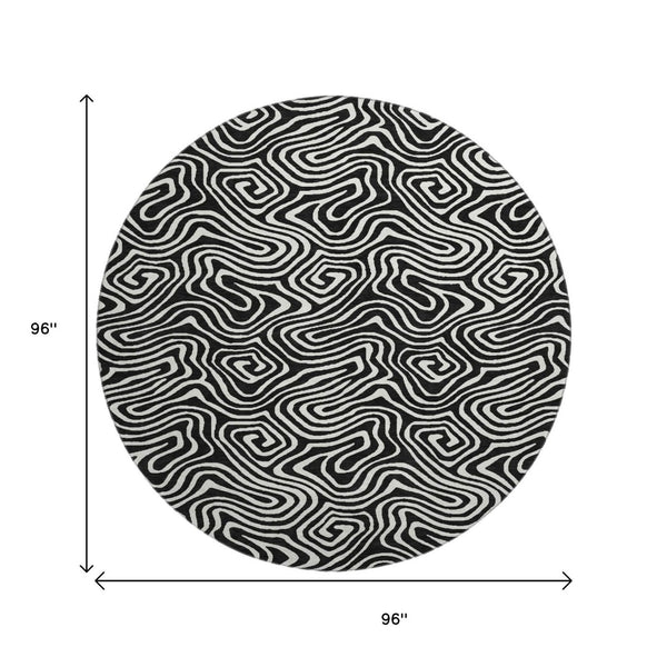 HomeRoots 8' Black And Ivory Abstract Round Rug - Washable, UV-Protected, Stain Resistant for Stylish Durability 680840