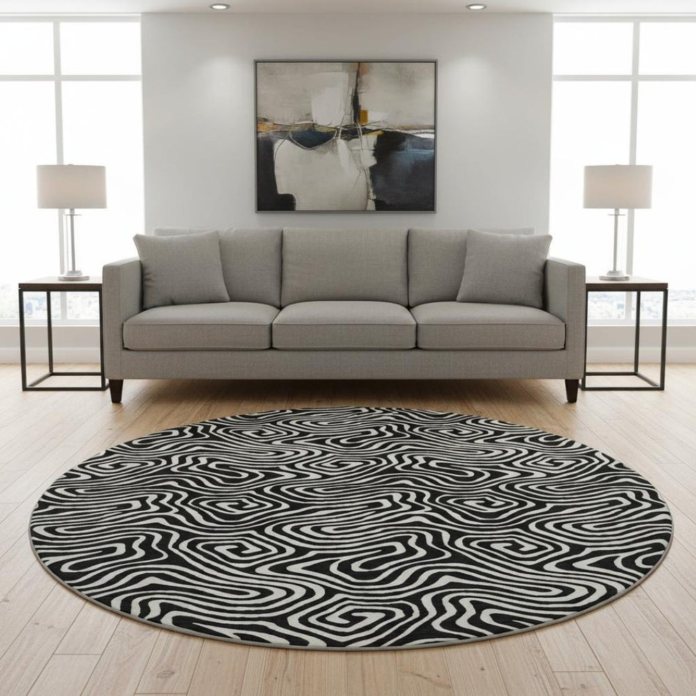 HomeRoots 8' Black And Ivory Abstract Round Rug - Washable, UV-Protected, Stain Resistant for Stylish Durability 680840