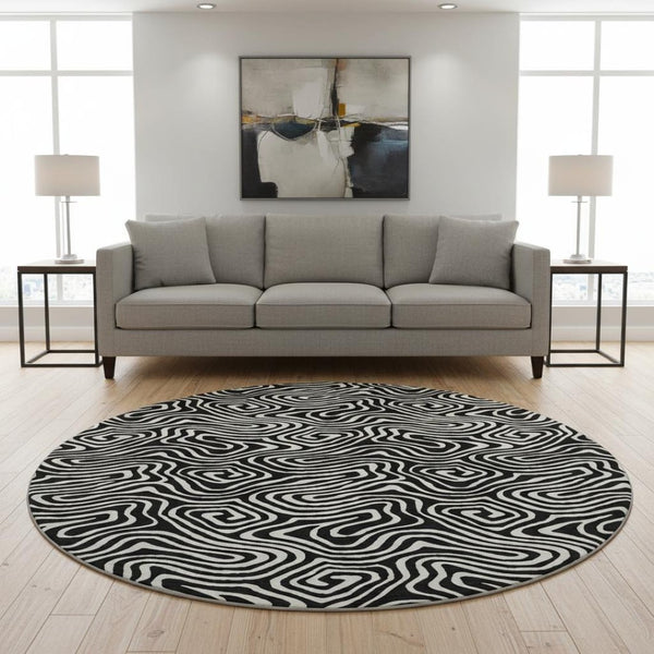 HomeRoots 8' Black And Ivory Abstract Round Rug - Washable, UV-Protected, Stain Resistant for Stylish Durability 680840
