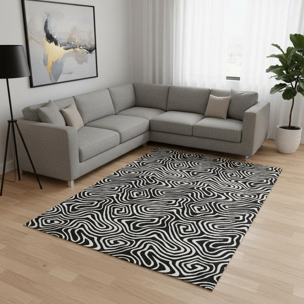 HomeRoots 8' X 10' Black And Ivory Abstract Area Rug - Washable, UV Protected & Durable for Modern Spaces 680841