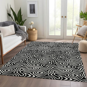 HomeRoots 8' X 10' Black And Ivory Abstract Area Rug - Washable, UV Protected & Durable for Modern Spaces 680841
