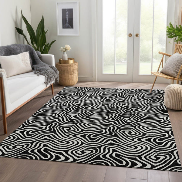 HomeRoots 8' X 10' Black And Ivory Abstract Area Rug - Washable, UV Protected & Durable for Modern Spaces 680841
