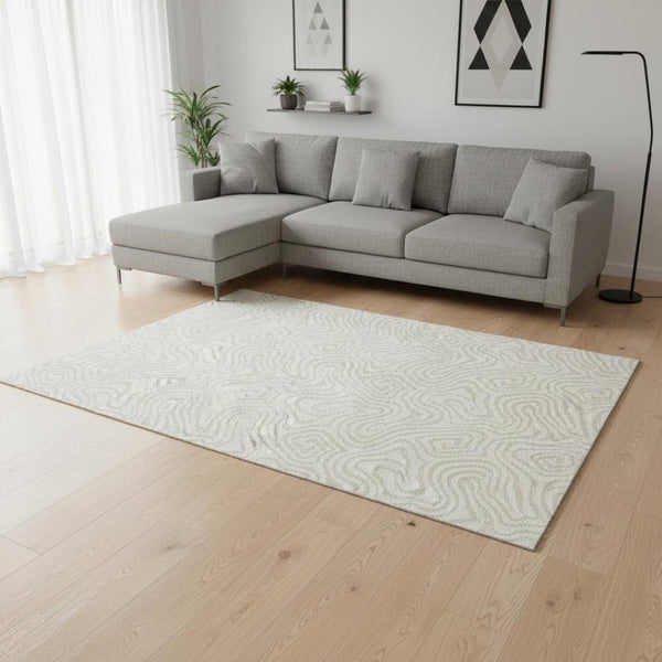 HomeRoots 9' X 12' Ivory Beige Abstract Area Rug - Washable, UV Protected, Stain Resistant for High-Traffic Spaces 680878
