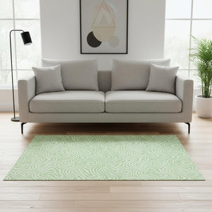 HomeRoots 5' X 8' Stylish Mint Green & Ivory Abstract Area Rug - Washable, UV Protected, Family-Friendly Design 680887