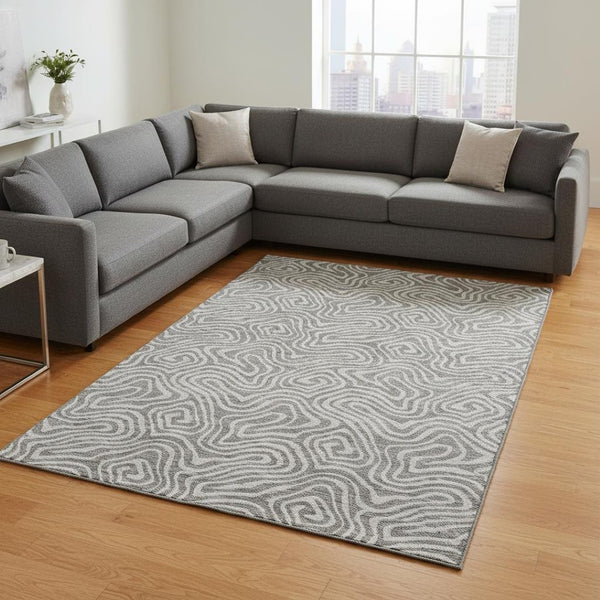 HomeRoots 9' X 12' Modern Taupe and Ivory Abstract Washable Area Rug – UV Resistant for Family-Friendly Spaces 680920