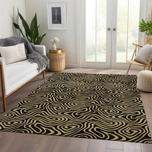 HomeRoots 5' X 8' Black And Gold Abstract Area Rug – Stylish, Washable, UV-Protected for Modern Living Spaces 680935
